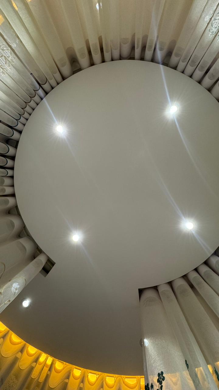 Ceiling mounted circular curtain track and sheer curtain detail by Curtivelle