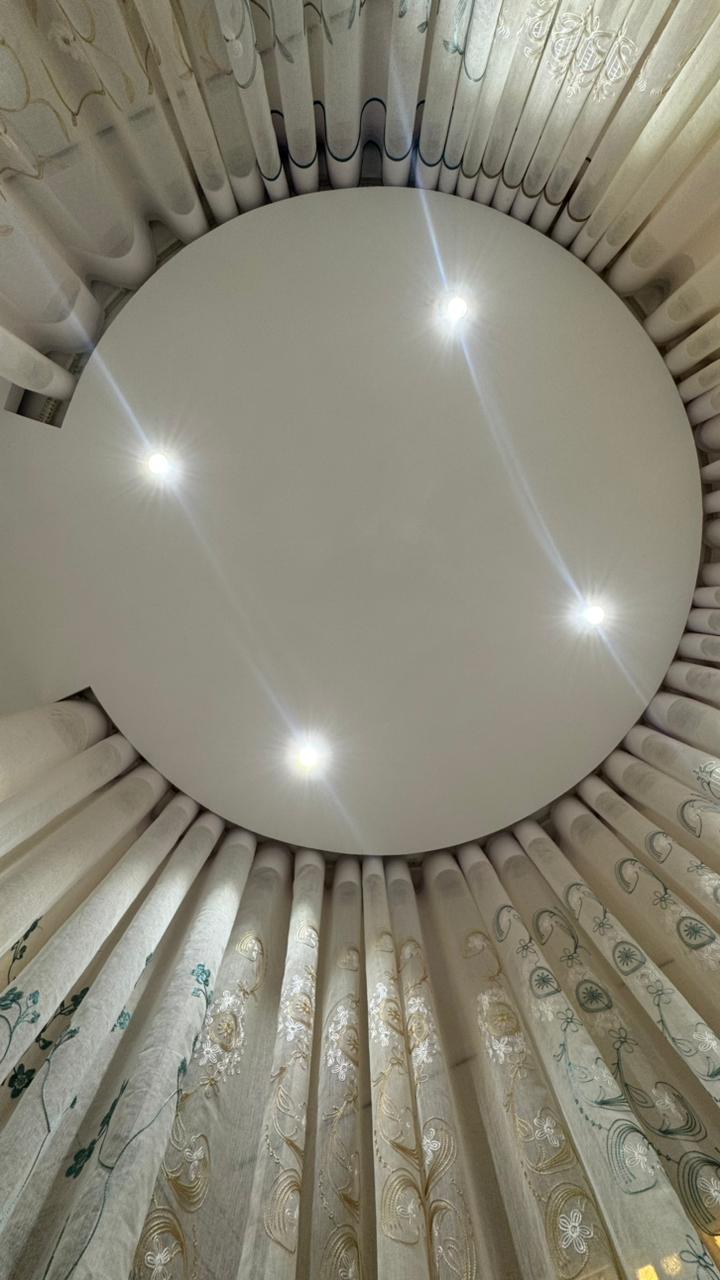 Ceiling mounted circular curtain track and sheer curtain detail by Curtivelle