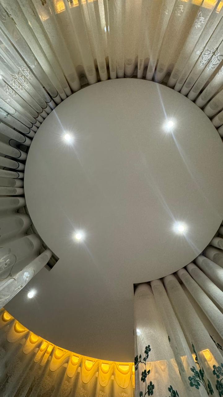 Ceiling mounted circular curtain track and sheer curtain detail by Curtivelle
