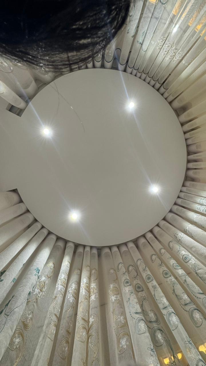 Ceiling mounted circular curtain track and sheer curtain detail by Curtivelle