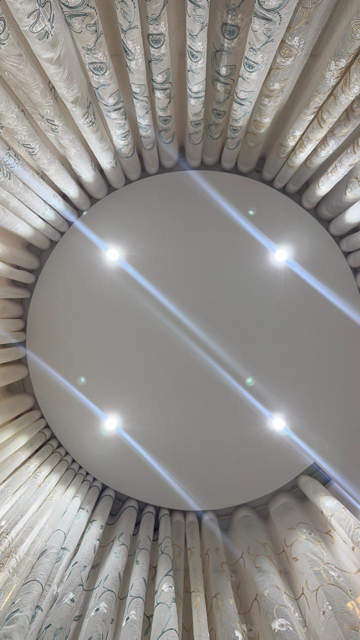 Ceiling mounted circular curtain track and sheer curtain detail by Curtivelle