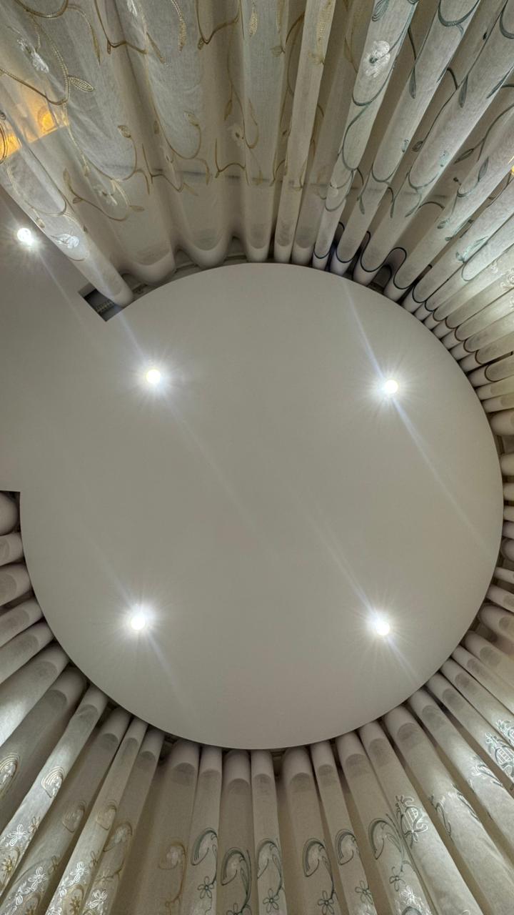 Ceiling mounted circular curtain track and sheer curtain detail by Curtivelle