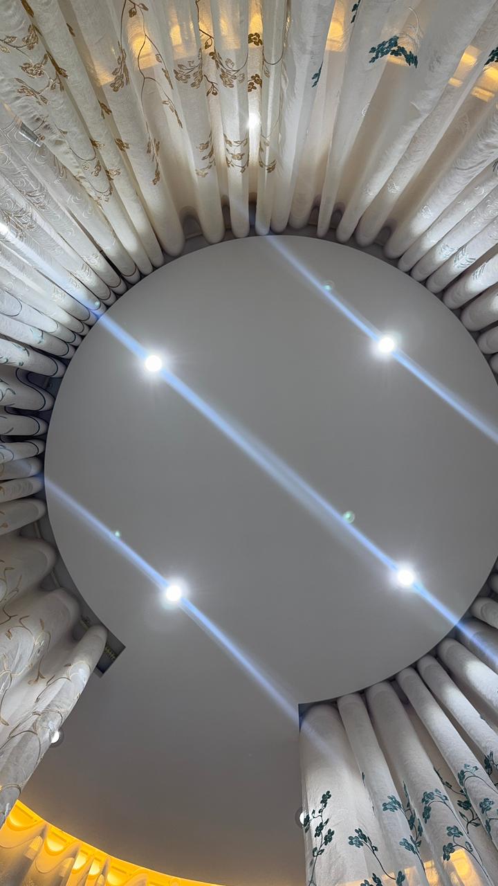 Ceiling mounted circular curtain track and sheer curtain detail by Curtivelle