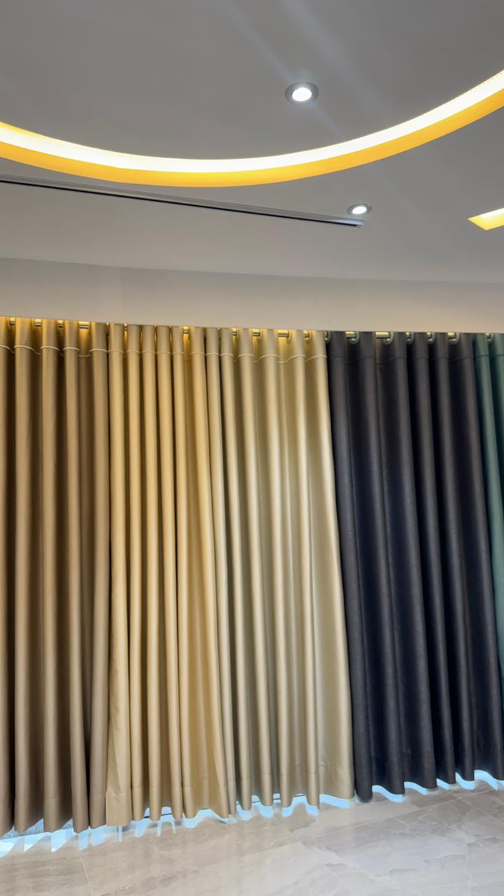 Luxury curtain showroom display with colored fabric panels and modern lighting