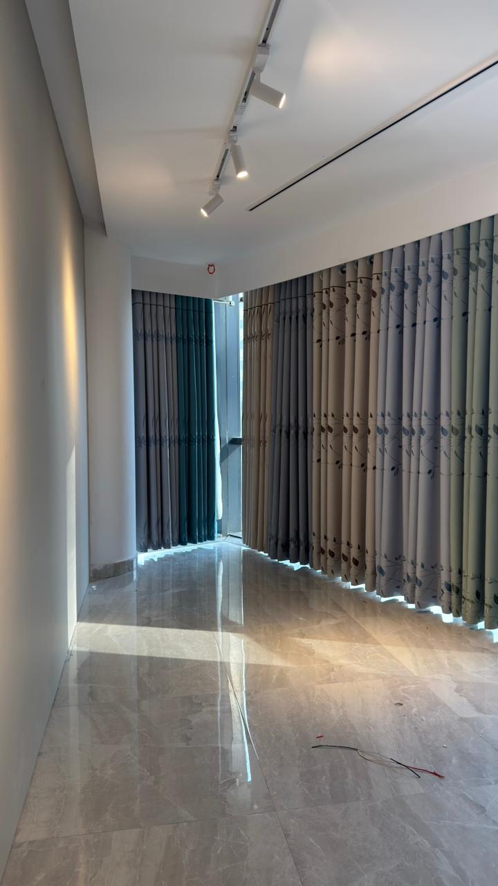 Modern room curtain installation with light filtering drapes by Curtivelle