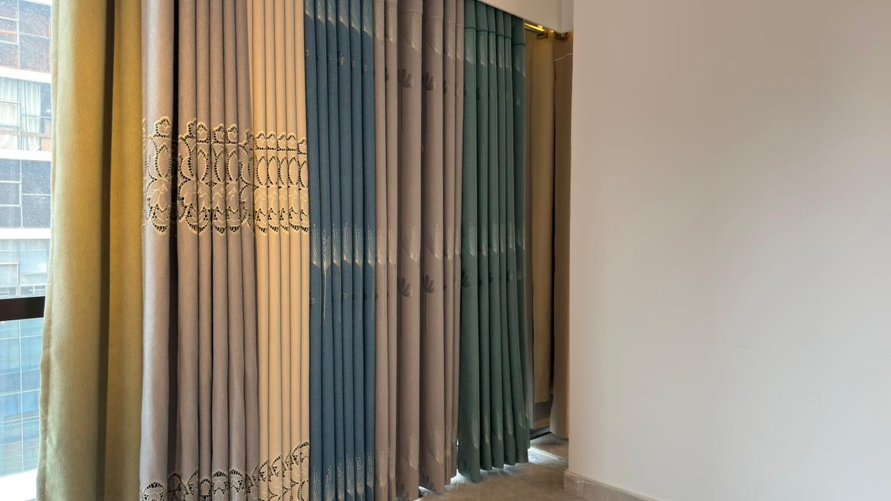 Modern room curtain installation with light filtering drapes by Curtivelle