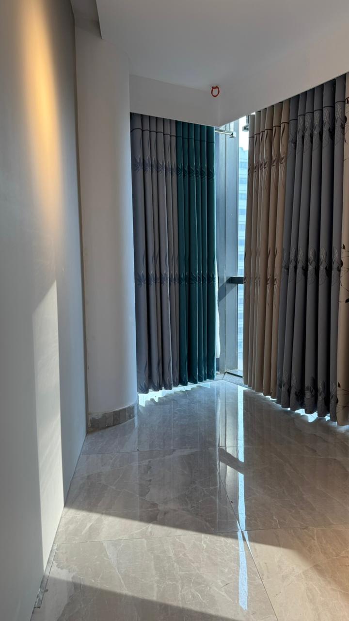 Modern room curtain installation with light filtering drapes by Curtivelle