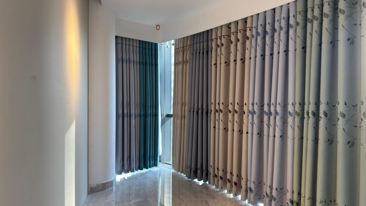 Modern room curtain installation with light filtering drapes by Curtivelle