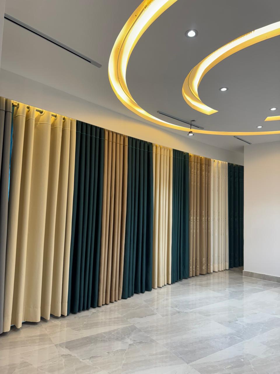 Modern curtain showroom interior with premium fabric panels and arched lighting