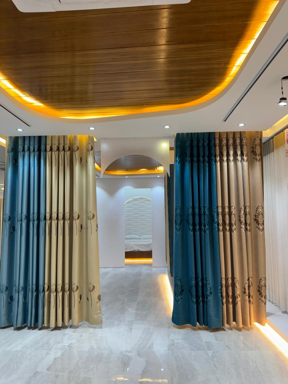 Modern curtain showroom interior with premium fabric panels and arched lighting
