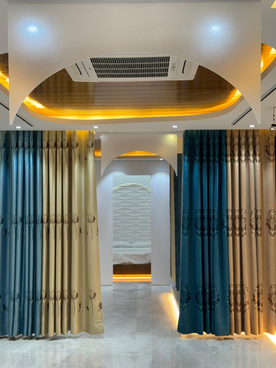 Modern curtain showroom interior with premium fabric panels and arched lighting