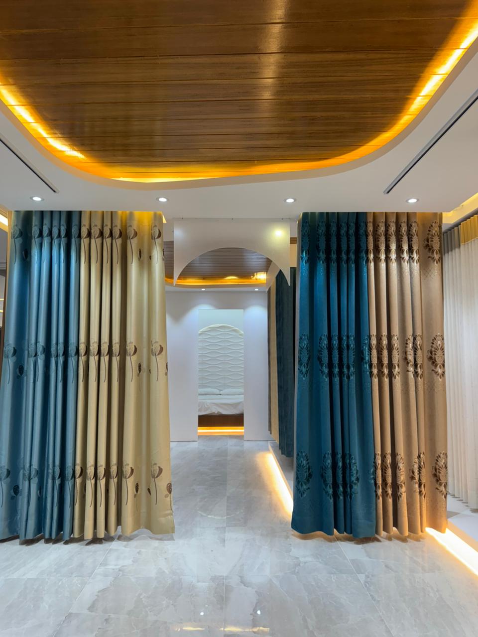 Modern curtain showroom interior with premium fabric panels and arched lighting