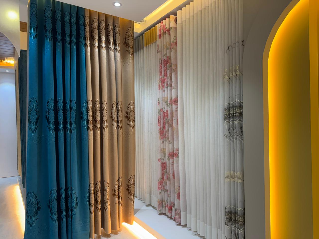 Premium curtain showroom interior with layered drapes and warm lighting