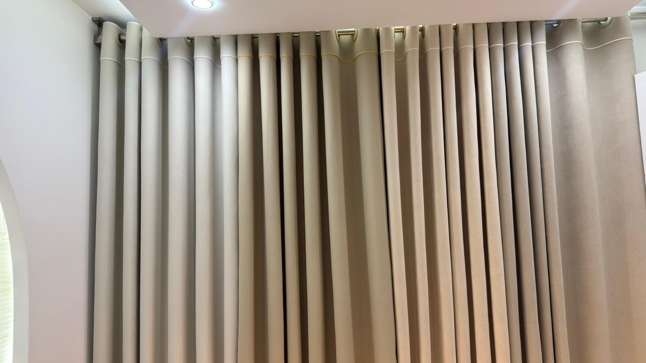 Close-up of premium pleated curtain fabrics in Curtivelle showroom