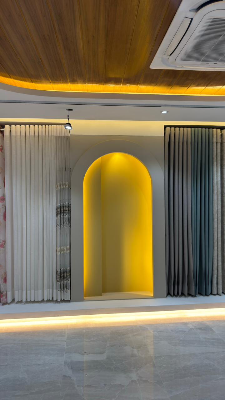 Close-up of premium pleated curtain fabrics in Curtivelle showroom