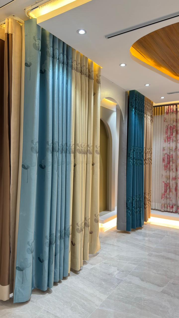 Close-up of premium pleated curtain fabrics in Curtivelle showroom