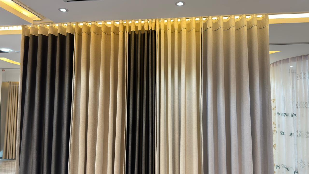 Close-up of premium pleated curtain fabrics in Curtivelle showroom
