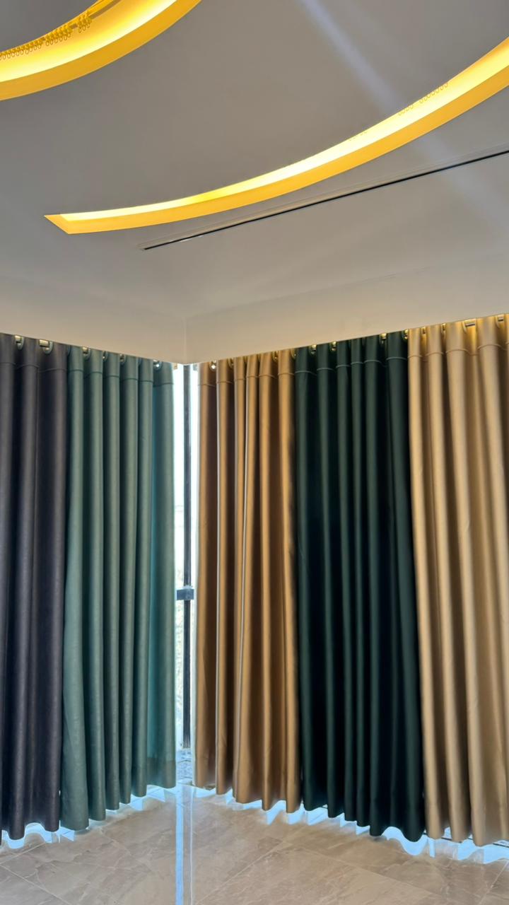 Wall-to-wall premium curtain fabric display in Curtivelle showroom