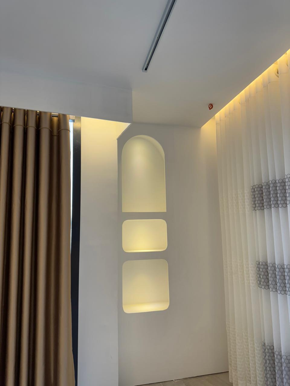 Wall-to-wall premium curtain fabric display in Curtivelle showroom