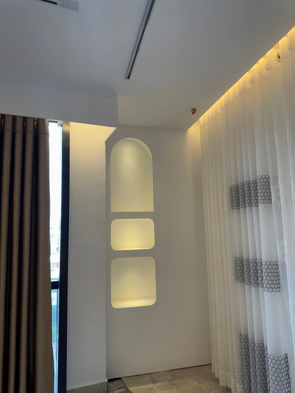 Wall-to-wall premium curtain fabric display in Curtivelle showroom